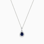 The Royale Bleu 14K White Gold Sapphire and Diamond Pendant features a teardrop sapphire encircled by shimmering diamonds, elegantly displayed on a white background.