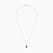 The Royale Bleu 14K White Gold Sapphire and Diamond Pendant features a teardrop sapphire encircled by shimmering diamonds, elegantly displayed on a white background.