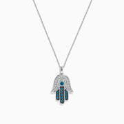 The Novelty 14K White Gold Blue and White Diamond Hamsa Pendant (0.35 TCW) is shown on a plain white background, featuring intricate diamond patterns on the pendant.