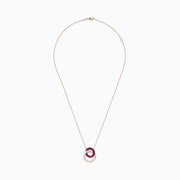 The Ruby Royale 14K Rose Gold Ruby and Diamond Intertwined Circles Pendant features two interlocking circles—one with rubies, one with diamonds—set against a white background, ideal for diamond jewelry lovers.