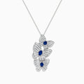 The 14K White Gold Blue Sapphire and Diamond Multi Butterfly Pendant features three butterflies accented with diamond-like stones and a central blue sapphire, hanging elegantly from a delicate chain.
