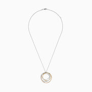 The Trio 14K 3-Color Gold Diamond Crossover Pendant features three interlocking circles—yellow gold, rose gold, and diamond-accented—on a fine silver chain, beautifully showcased against a white background.