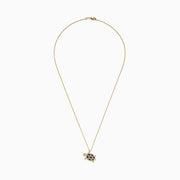 The Seaside 14K Gold Espresso & White Diamond Turtle Pendant (0.42 TCW) features a detailed jeweled shell, green eye, and turtle design on a chain necklace, with black, brown, and clear diamond accents.