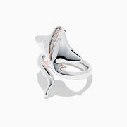 The 925 Sterling Silver & 14K Gold Diamond Stingray Wrap Ring features a flowing stingray design with 0.03 TCW diamonds and rose gold accents, its sculptural band elegantly curving to mimic the graceful movement of a stingray.