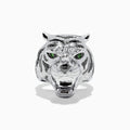 The Sterling Silver Black Diamond and Tsavorite Tiger Ring, 0.21 TCW, features a tiger’s head design with detailed fur, black diamonds, and vivid green Tsavorite eyes, displayed against a white background.