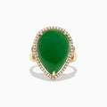 The 14K Yellow Gold Jade and Diamond Cocktail Ring, 14.08 TCW, showcases a large pear-shaped green jade accented by sparkling diamonds, all set in yellow gold and shown against a white background.