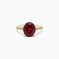 The Bordeaux 14K Yellow Gold Garnet and Diamond Ring, 4.76 TCW, showcases a large oval deep red garnet center with sparkling diamonds along the band.