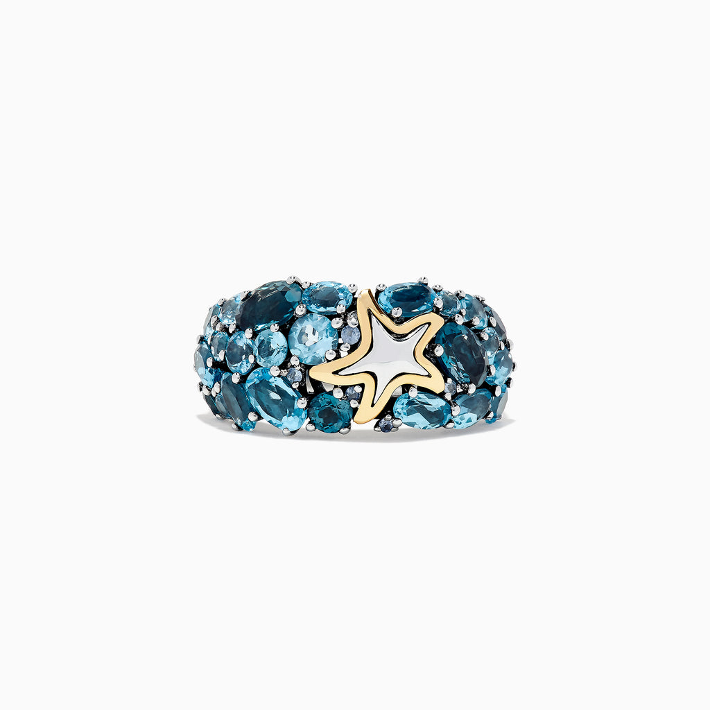 The Seaside Silver and 18K Gold Blue Topaz Starfish Ring, 6.70 TCW, features clusters of oval blue topaz stones set in silver with a gold-outlined starfish accent at the center, shown on a white background.