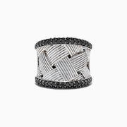 The 925 Sterling Silver Black Diamond Woven Ring, 1.23 TCW features a wide, textured woven design with two rows of black diamonds bordering the top and bottom edges.