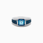 Mens 925 Sterling Silver Blue Topaz Ring featuring a large square-cut blue gemstone at the center with smaller round blue stones adorning both sides of the band.