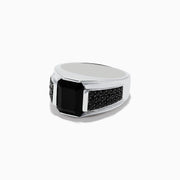 The Mens 925 Sterling Silver Onyx and Black Spinel Ring features a large rectangular black onyx centerpiece, accented by small round black spinel stones set along each side of the band, displayed on a white background.