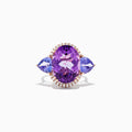 The 14K Rose Gold Amethyst, Tanzanite and Diamond Ring, 10.28 TCW features a striking amethyst center, accented by tanzanites and surrounded by a sparkling diamond halo.