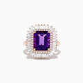 The 14K Rose Gold Amethyst and Diamond Cocktail Ring features a large rectangular amethyst center, encircled by two rows of sparkling white baguette and round diamonds in a dazzling halo setting.