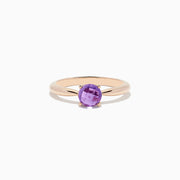 A 14K rose gold ring features a round-cut amethyst gemstone (0.81 TCW) in a classic prong setting against a white background—an elegant Amethyst Ring perfect for any occasion.