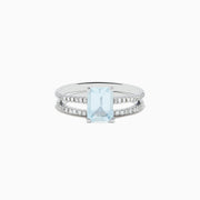 The Aquarius 14K Gold Aquamarine and Diamond Ring Set features a rectangular aquamarine centerpiece with two diamond-accented bands, shown against a plain white background.
