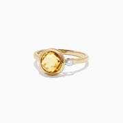 The Sunset 14K Yellow Gold Citrine and Diamond Ring, 1.53 TCW, features a round faceted citrine centerpiece accented by a small round diamond, shown against a plain white background.
