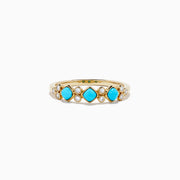 The 14K Yellow Gold Turquoise and Diamond Ring, 0.39 TCW, features three turquoise stones and six small round diamonds set in an alternating pattern along the band.