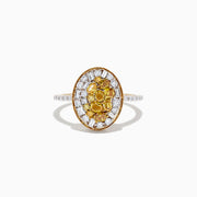 The 14K Yellow Gold Yellow and White Diamond Ring, 1.15 TCW, features an oval design with a cluster of yellow gemstones at the center, surrounded by white diamonds and baguette-cut stones, plus small clear stones on each side of the band.