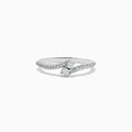 The 14k White Gold Diamond ring, 0.24 TCW, features a central round diamond on a curved band with sparkling accents and is displayed against a plain white background.
