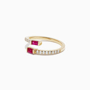 The Ruby Royale 14K Yellow Gold Ruby and Diamond Bypass Ring, 0.52 TCW, features sparkling white diamonds on one side and rectangular rubies set at each end.