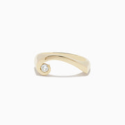 The DOro 14K Yellow Gold Diamond Swirl Ring features a modern twisted band with a single round diamond at one end, shown on a white background.
