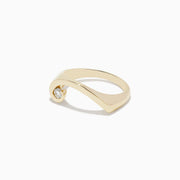 The DOro 14K Yellow Gold Diamond Swirl Ring features a modern twisted band with a single round diamond at one end, shown on a white background.
