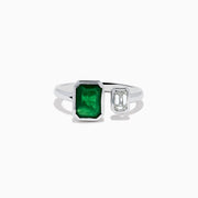 The 14K White Gold Emerald and Diamond Toi Et Moi Ring features a large rectangular green emerald and a smaller clear diamond set on a simple white gold band.