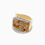 The 14K Yellow Gold Multi Color Diamond Statement Ring features a wavy design, yellow, orange, and pink gemstones, and is bordered by two rows of sparkling white multi color diamonds.