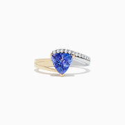 The Nahla Siri 14K 2-Tone Gold Tanzanite and Diamond Ring, 1.66 TCW, showcases a triangular-cut tanzanite center accented by a curved row of round diamonds on a plain white background.