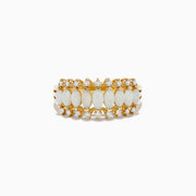 The Aurora 14K Yellow Gold Opal and Diamond Ring features a row of oval opals bordered by two rows of round diamonds on each side, creating a symmetrical, elegant look.