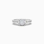 A beautiful Bridal 14K White Gold Diamond Cluster Ring and Band Set, 0.72 TCW, featuring a round central diamond, surrounded by smaller diamonds on a split shank for extra sparkle.