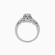 A beautiful Bridal 14K White Gold Diamond Cluster Ring and Band Set, 0.72 TCW, featuring a round central diamond, surrounded by smaller diamonds on a split shank for extra sparkle.