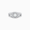 The Pave Classica 14K White Gold Diamond Engagement & Wedding Ring Set 1.34 TCW features a round center diamond, a sparkling diamond halo, and additional diamonds on the split band, shown against a white background.