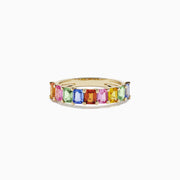 The Watercolors 14K Yellow Gold Multi Sapphire Ring, 2.22 TCW, showcases a row of rectangular pink, blue, green, yellow, and orange sapphires in a continuous band design.