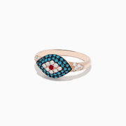The Novelty 14K Rose Gold Blue Diamond and Ruby Evil Eye Ring features a central ruby, white and blue stones forming an evil eye motif, and small diamonds set along the band.