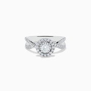 The Pave Classica 14K White Gold Diamond Ring features a round center diamond, double halo of smaller diamonds, and a split shank band with sparkling stones, beautifully displayed on a white background.
