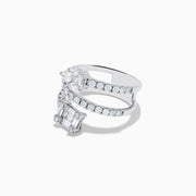 The 14K White Gold Diamond Spiral Ring by Effy showcases two rows of round diamonds, with a cluster of oval diamonds at one end and a square of baguette diamonds at the other, all set against a white background.