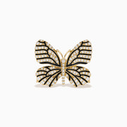 The Nature 14K Yellow Gold Black and White Diamond Butterfly Ring features sparkling diamonds and black details on its wings, echoing the elegance of black and white diamond jewelry, shown against a plain white background.