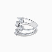 The Classique 14K White Gold Diamond Ring features three spiral bands with square clusters of baguette-cut diamonds and round diamonds along each band, all beautifully set in polished white gold.