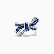 The Royal Bleu 14K White Gold Sapphire and Diamond Bow Ring, 1.88 TCW, features a bow design with sapphire rows bordered by diamonds, displayed against a white background.