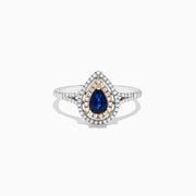 The Royale Bleu 14K Two Tone Gold Sapphire and Diamond Ring, 0.77 TCW, features a pear-shaped sapphire center with double diamond halos, gold accents, and a diamond-adorned band.