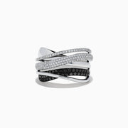 The Caviar 14K White Gold White and Black Diamond Crossover Ring features overlapping bands, some accented with white and black diamonds, creating a striking crisscross pattern against a pristine white gold setting.