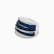 The Royale Bleu 14K White Gold Blue Sapphire and Diamond Crossover Ring showcases alternating blue sapphires and white diamonds in a luminous stacked, overlapping design.