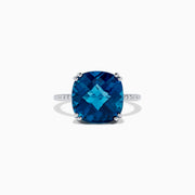 The Ocean Bleu 14K White Gold London Blue Topaz and Diamond Ring, 8.40 TCW, showcases a large cushion-cut London Blue Topaz center with four prongs and round diamonds set along the band.