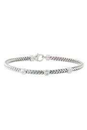 The 925 Sterling Silver and Diamond Bracelet (.04 TCW) features a braided design with three round diamond accents and a secure lobster clasp closure.