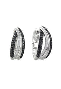 These 14K White Gold Black and White Diamond Earrings (.71 TCW) feature three overlapping silver hoops—two with black stones, one with clear—for a sophisticated, stylish look.