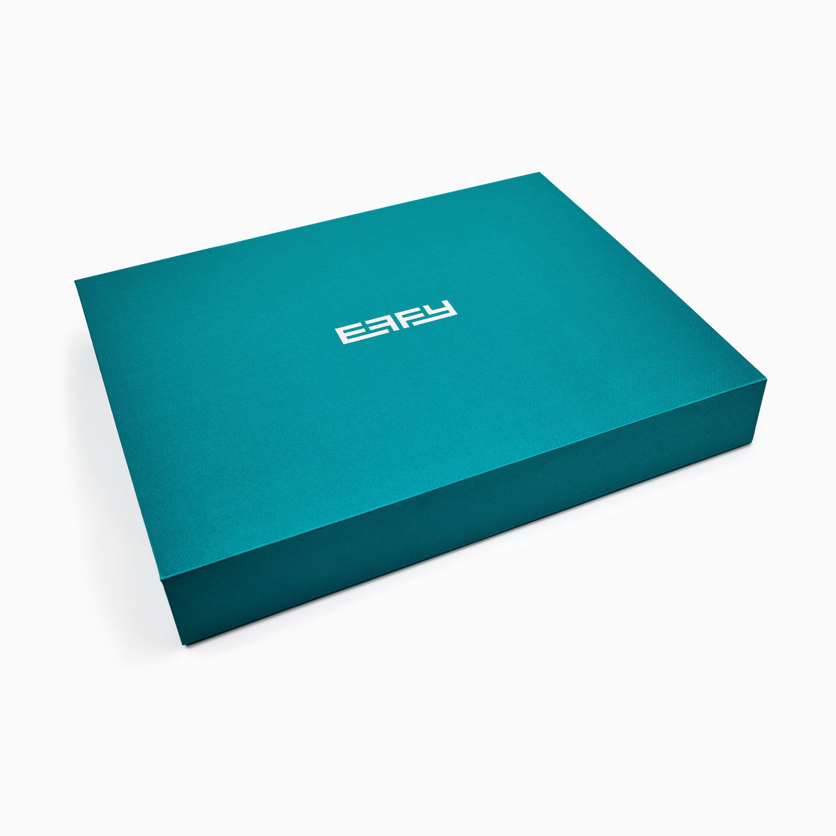 An open teal gift box showcases the Effy Passport Holder and Luggage Tag Travel Set, including a matching vegan leather passport holder, luggage tag, and pen, each neatly arranged in fitted compartments against a white background.
