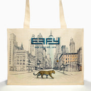 The Effy Linen Blend Embroidered Logo NY Skyline Tote features a cityscape with skyscrapers, a blue SPY logo, NEW YORK EST. 1979, and a leopard in the foreground from the Effy New York Skyline collection.