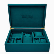 Effy Signature Jewelry Box with 7-piece removable inserts in teal velvet features organized compartments, removable trays, a pillow, and a round section. Open the box to display versatile storage options, with the ESPY brand name elegantly embossed inside the lid.