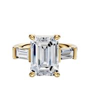 The 14K Yellow Gold 3-Stone Baguette East/West Side Stones 0.25TCW Engagement Ring features a prominent center stone with two baguette side stones, set in a four-prong setting and displayed against a white background.